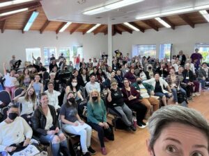 Artistic Director Kathleen Hansen takes a selfie with the members of SDWC