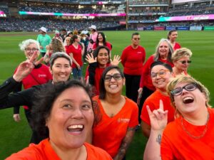 SDWC members pose for a photo on the field at Out at the Park with the San Diego Padres!
